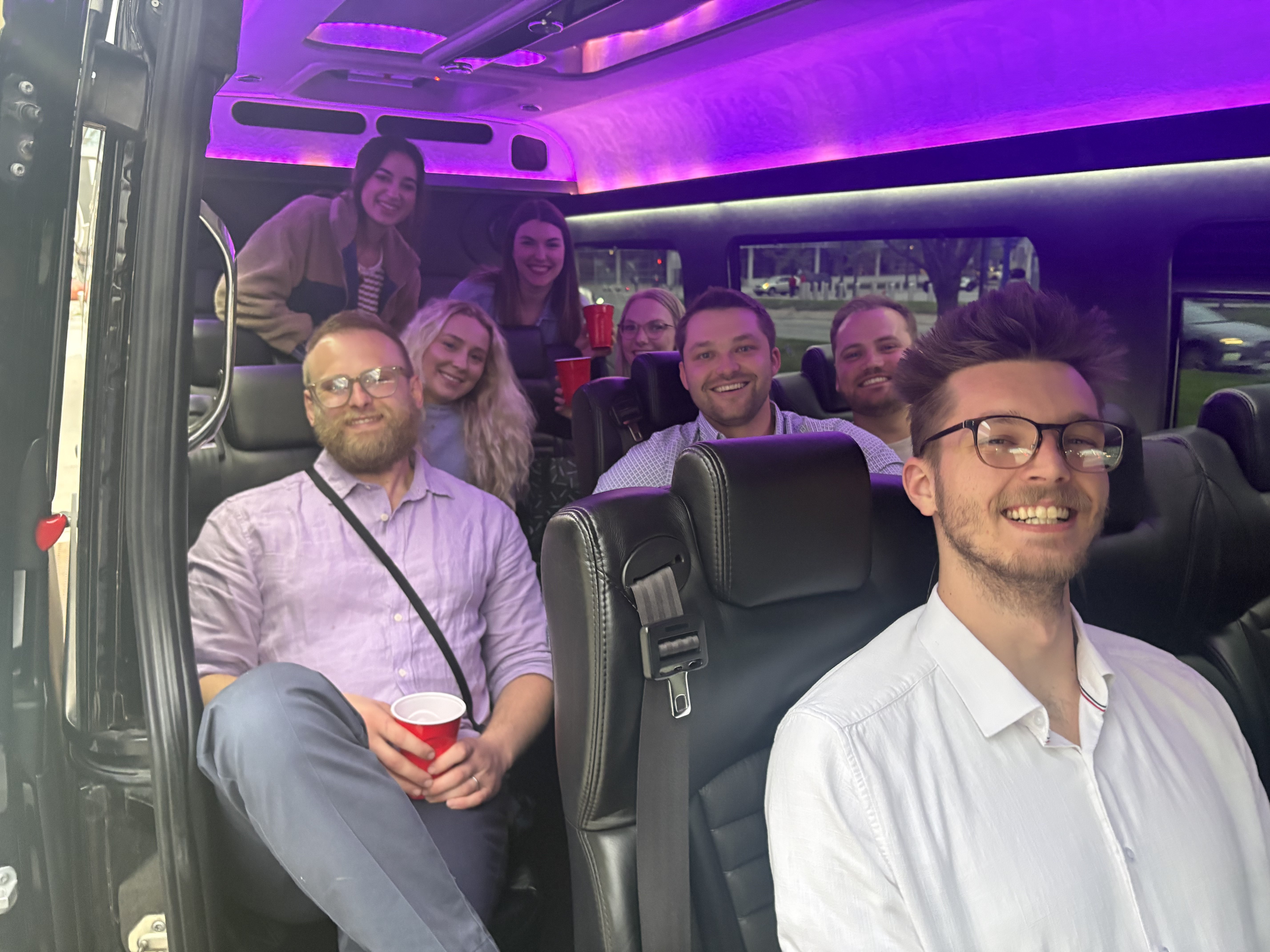Group enjoying the ride inside the VET'd Transportation Sprinter